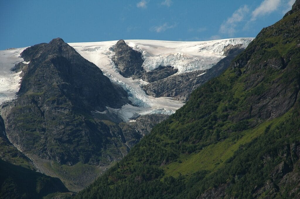 Mountain trail in Stryn leading towards glacier-topped peaks, offering crowd-free views of Jostedalsbreen