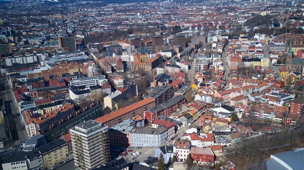 Residential street in Tøyen, Oslo with colorful buildings and everyday neighborhood life near the city’s best street art