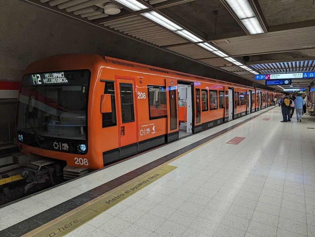 Helsinki metro station interior showing modern elevator and level platform, fully wheelchair accessible transit