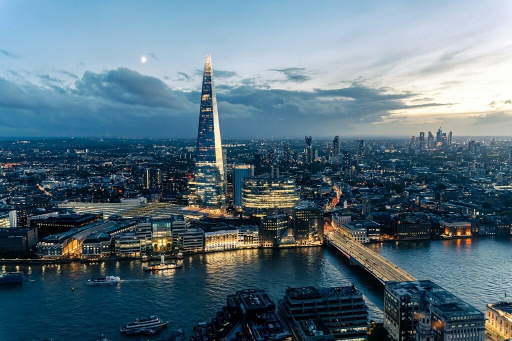 London skyline at sunset viewed from a high observation deck, representing the step-free views from the Shard