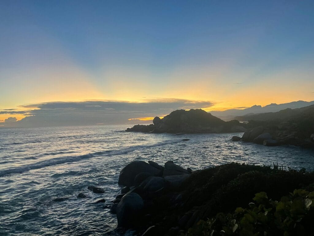 Colombia Tayrona National Park where jungle meets turquoise beach with hiking trails, budget adventure destination