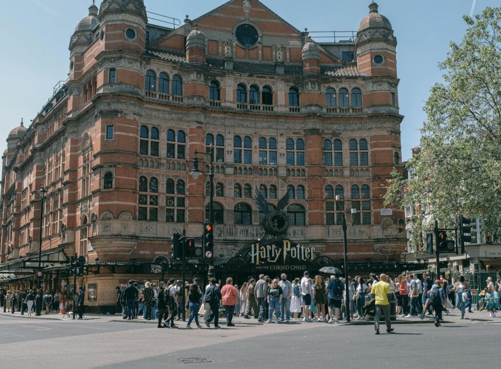 Crowd outside a West End theatre in London, where stalls level offers wheelchair spaces and companion seating