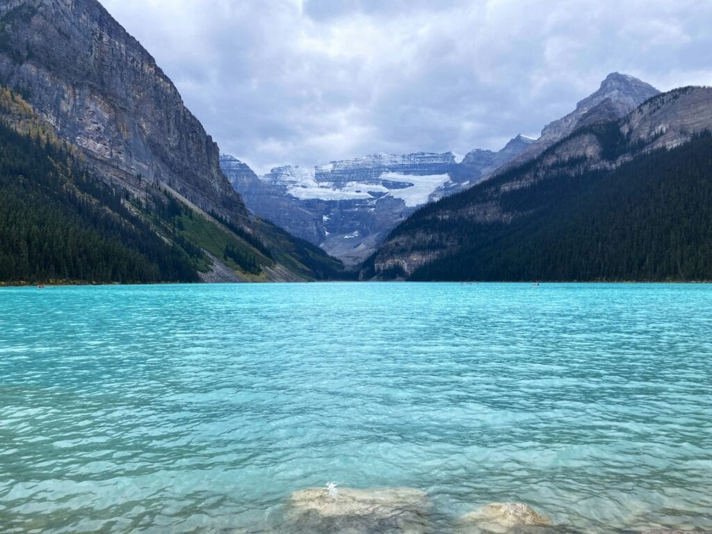 Lake Louise turquoise glacial water with Mt. Victoria reflected, Canadian Rockies summer destination with hiking trail