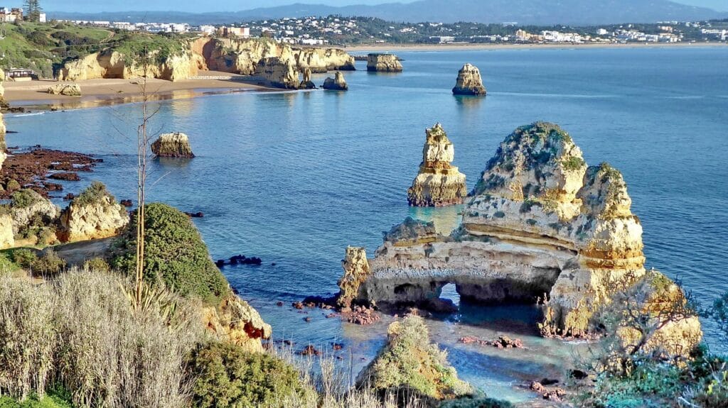 Portugal Algarve golden cliff formations Ponta da Piedade, kayaking turquoise water, coastal spring hiking March