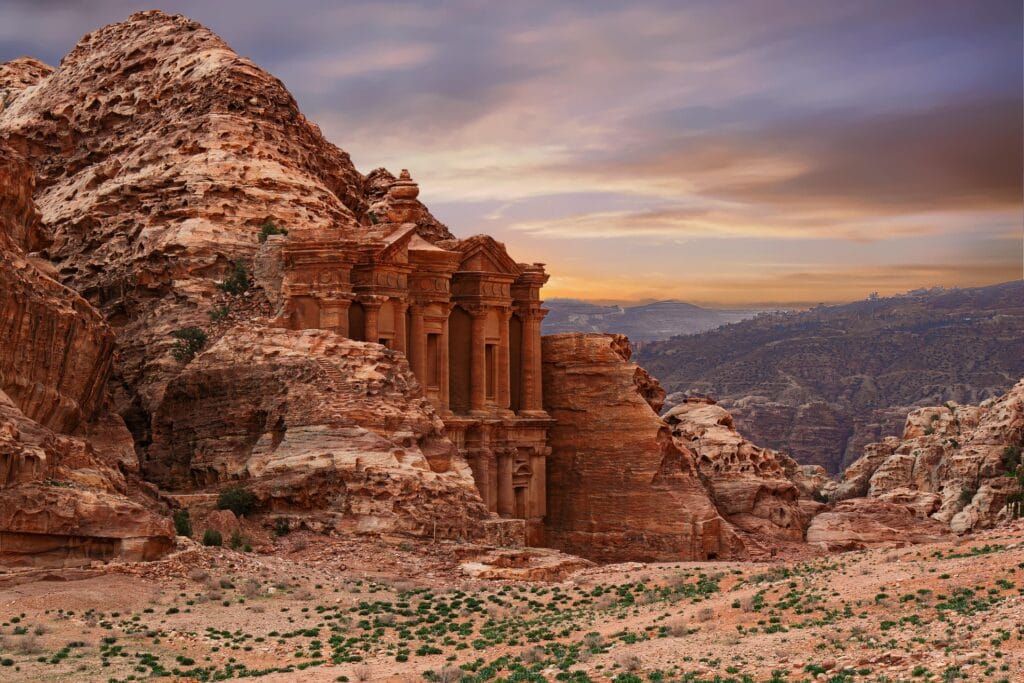 The monumental rock-cut Monastery known as Ad Deir in the ancient city of Petra, Jordan, at sunset.