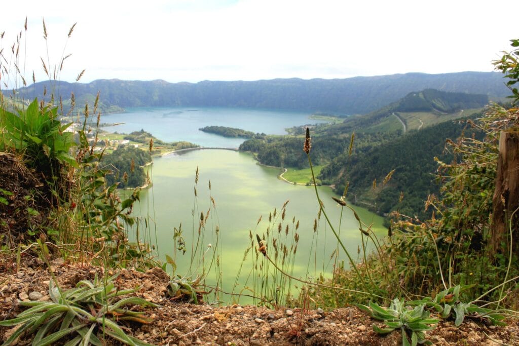 High-angle view of the green and blue lakes of Sete Cidades in the Azores, surrounded by lush volcanic hills