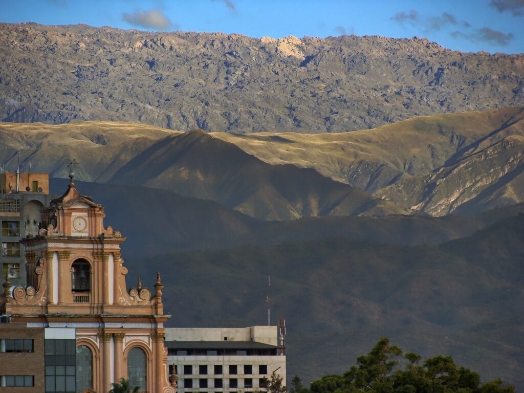 A historic church with high-altitude mountains in the background in Salta, Argentina