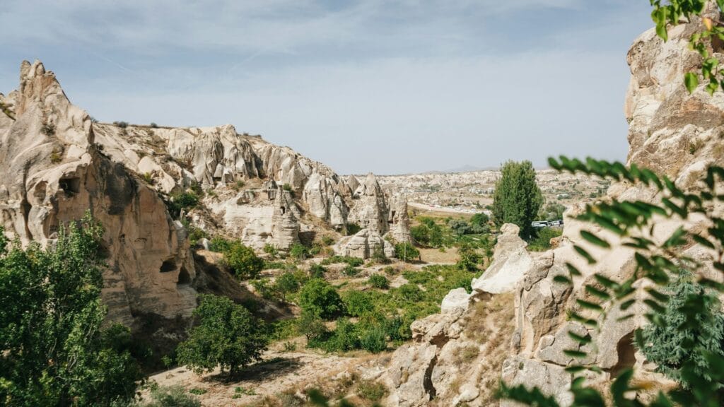 The unique fairy chimney rock formations and wildflower-filled valleys of Cappadocia, Turkey, in spring.
