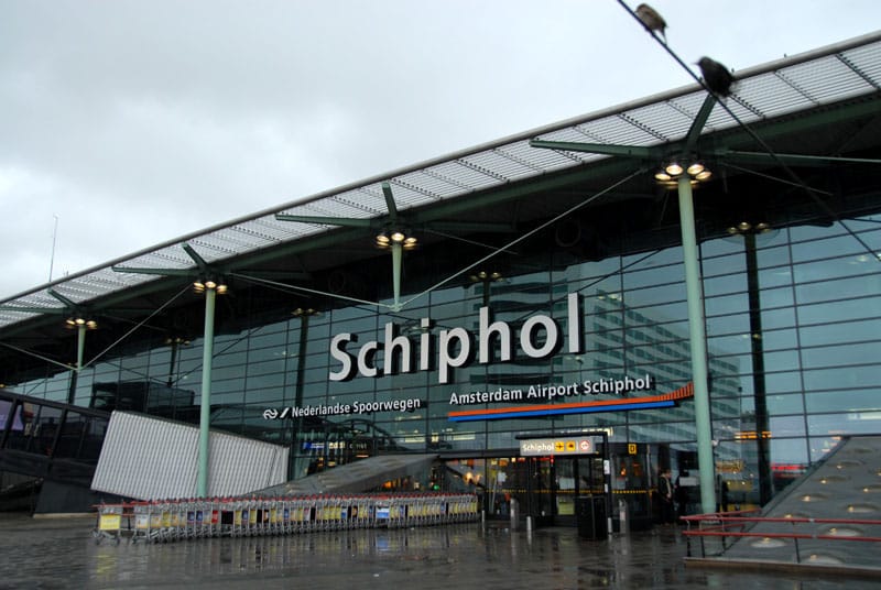Amsterdam Schiphol Airport terminal exterior, highlighting accessible arrival options for wheelchair travelers