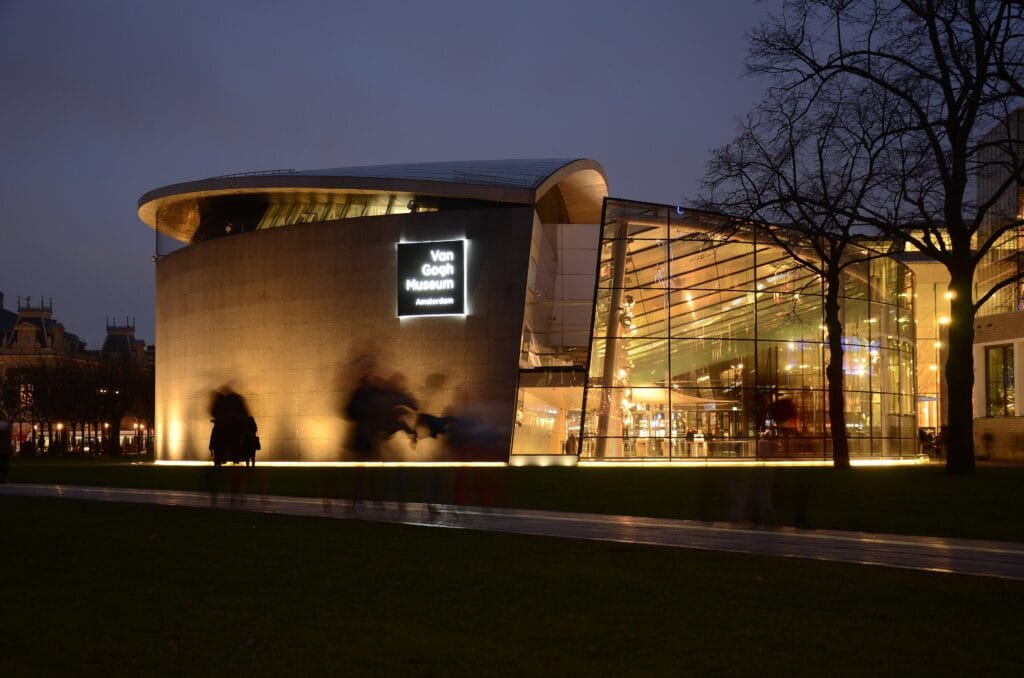 Van Gogh Museum exterior at night in Amsterdam, highlighting accessible museum access