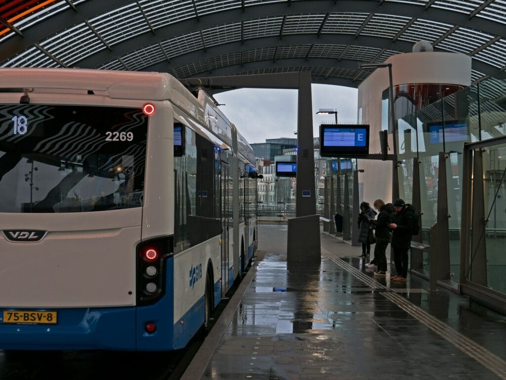 GVB bus at a stop in Amsterdam, representing low-floor accessible bus travel