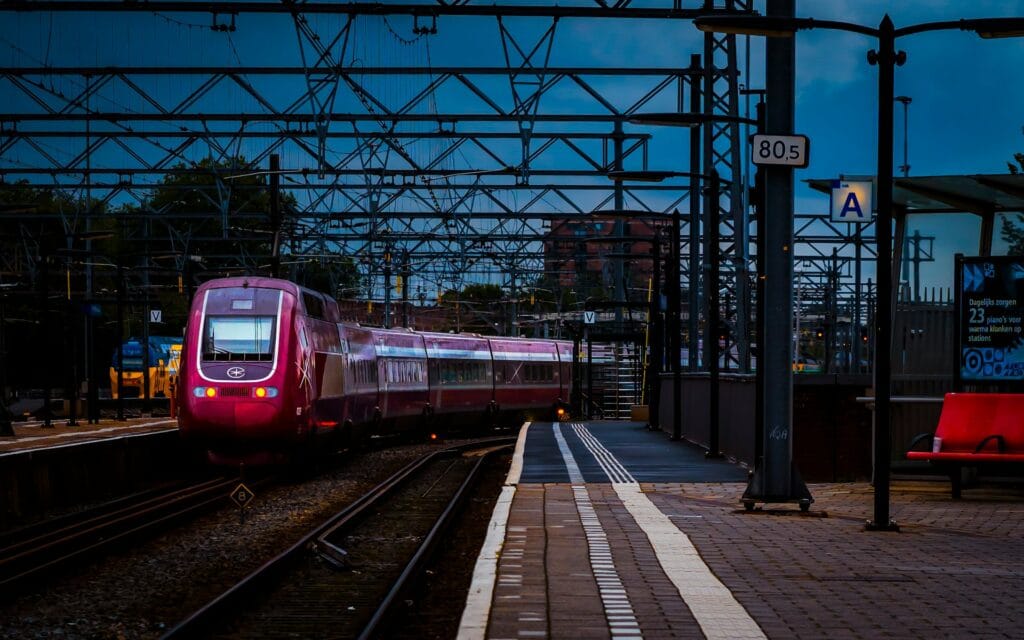 Train at Amsterdam Centraal station, representing step-free rail access for wheelchair users
