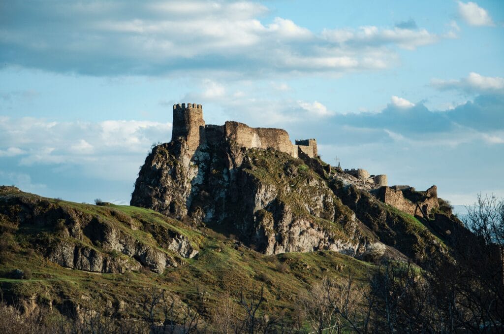 Hammershus medieval concrete castle ruins standing on a rocky mountain cliff in Bornholm, Denmark.