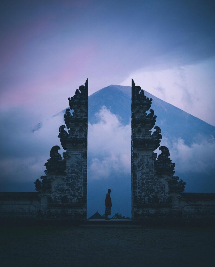 Traditional Hindu water temple architecture and lush greenery in Bali, Indonesia, during the dry season