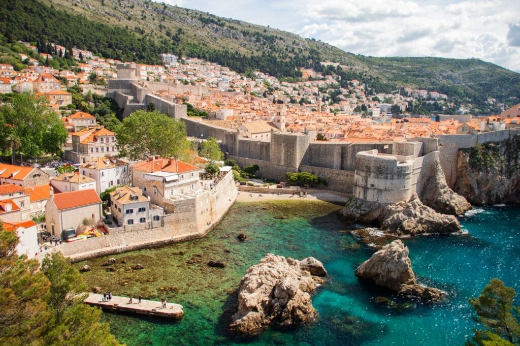 Historic stone walls and fortress of Dubrovnik, Croatia, overlooking the crystal-clear Adriatic Sea