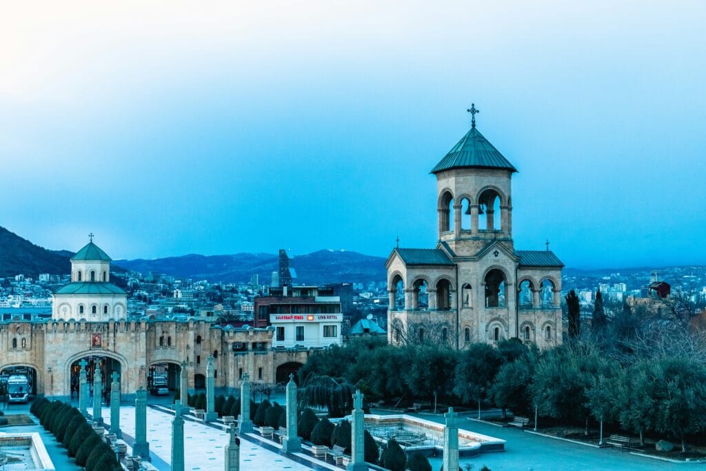 Large historic building with a prominent clock tower in the old town of Tbilisi, Georgia